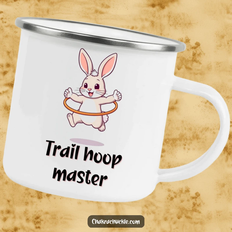 Funny enamel camping mug showing a bouncy bunny in a warrior pose, jumping through a hula hoop, perfect for outdoor fun.