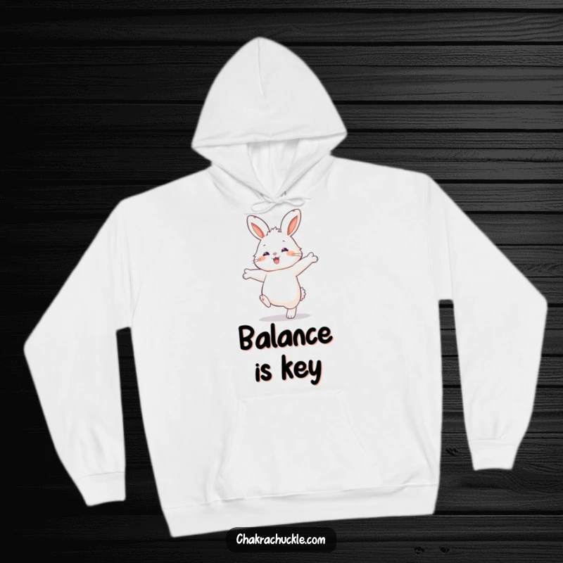 Funny Rabbit Balance Hoodie: Fluffy rabbit balancing on one paw, designed for warmth and amusement.