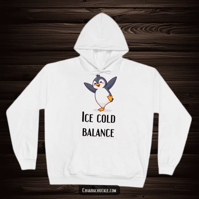 Funny kawaii penguin hoodie depicting a cute, bouncing penguin energetically striking a yoga balance pose, radiating fun.