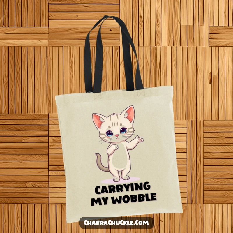 Funny Kitten Yoga Tote Bag with a wobbly cat in Tree Pose, symbolizing playful determination.